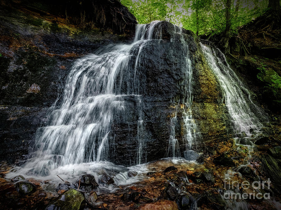 A cascading waterfall Photograph by Bill Frische