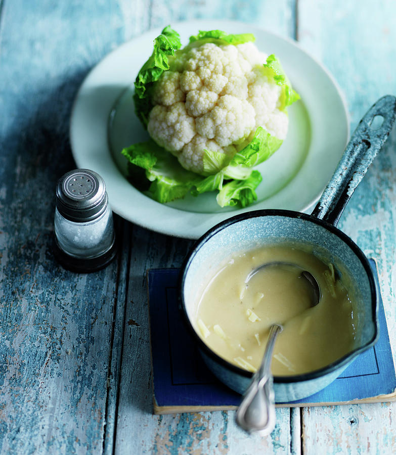 A Cauliflower With Cheese Sauce In A Pan Photograph by Karen Thomas