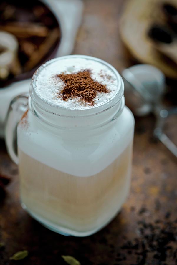A Chai Latte Decorated With A Cocoa Powder Star Photograph by Dorota Indycka