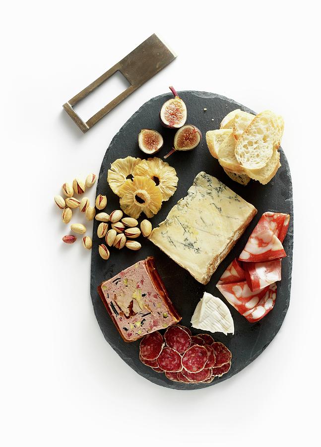A Charcuterie And Cheese Board With Pistachios And Fruits Photograph by Clinton Hussey
