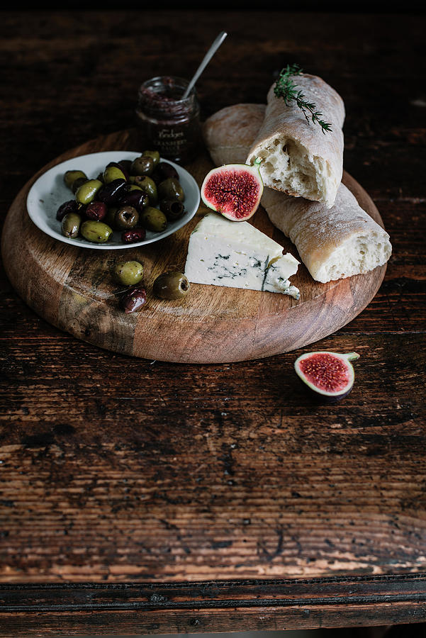A Cheese Plate With Bread, Olives And Onion Jam Photograph by Justina Ramanauskiene