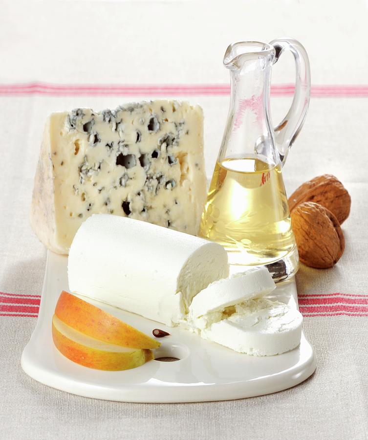 A Cheese Platter With Roquefort And A Roll Of Goats Cheese Photograph by Franco Pizzochero