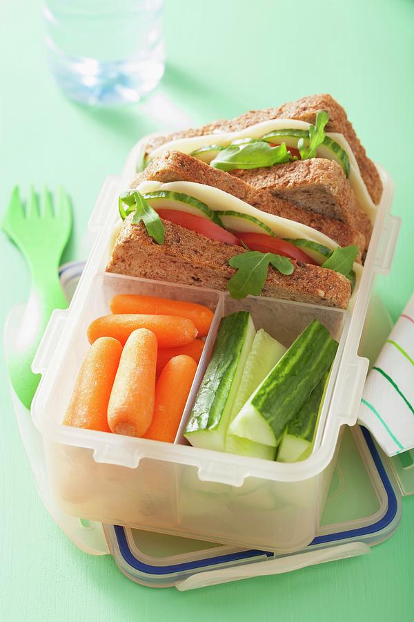 A Cheese Sandwich And Raw Vegetables In A Lunch Box Photograph by Olga Miltsova