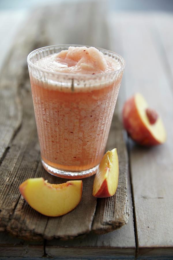 A Cherry And Peach Smoothie Photograph by Jo Kirchherr