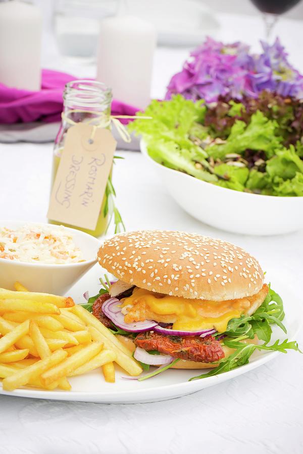 Chicken Photograph - A Chicken Burger With Dried Tomatoes, Rocket And Mango Sauce With Fries And Coleslaw by Esther Hildebrandt