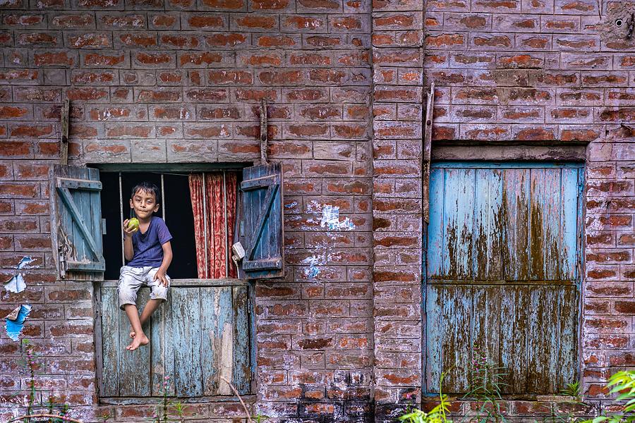 A Child Sitting On A Window Photograph by Md Sabbir