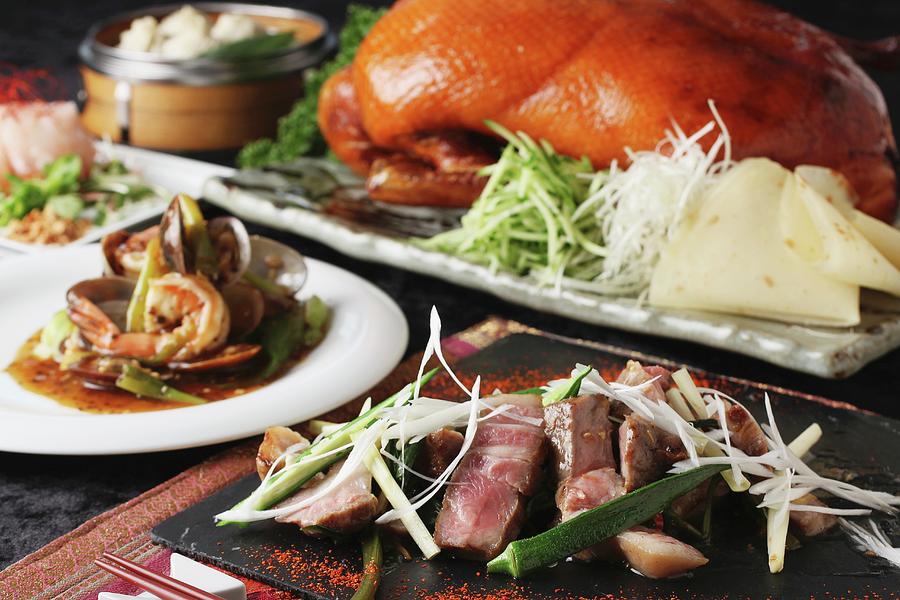A Chinese Buffet Featuring Grilled Beef, Peking Duck And Prawns With Vegetables Photograph by Yuichi Nishihata Photography