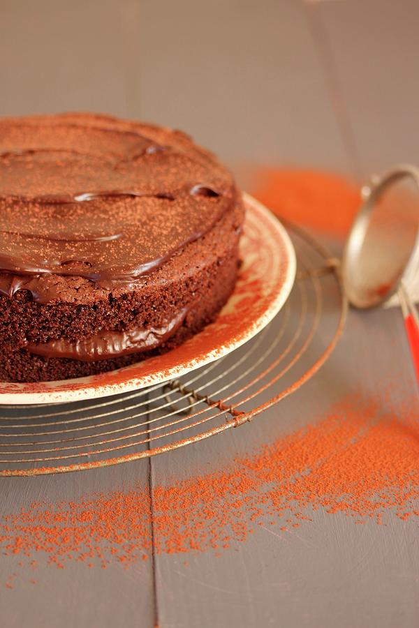 A Chocolate Cake Dusted With Cocoa Powder Photograph by Carmen Mariani