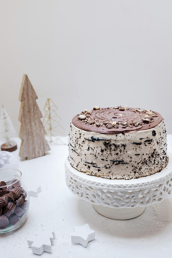 A Chocolate Cake On A Cake Stand On A Table Decorated For Christmas Photograph by Visnja Sesum