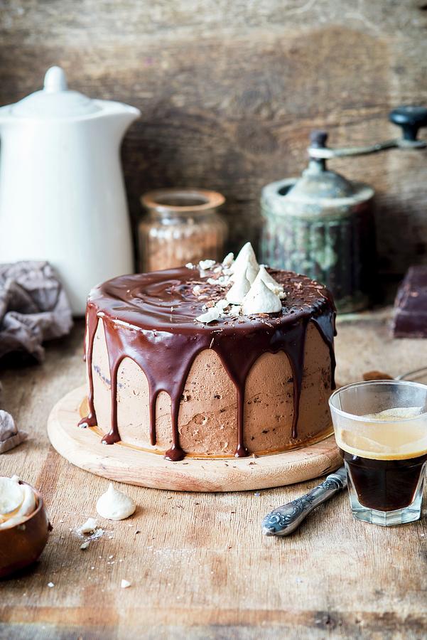 A Chocolate Cream Cake Topped With Ganache And Meringue Photograph by Irina Meliukh