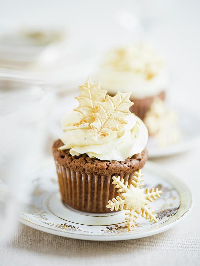 A Chocolate Cupcake Topped With Buttercream And Christmas Sugar Decorations Photograph by Clara Tuma