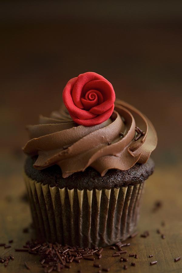 A Chocolate Cupcake With A Rose Decoration For Valentines Day Photograph by Eising Studio