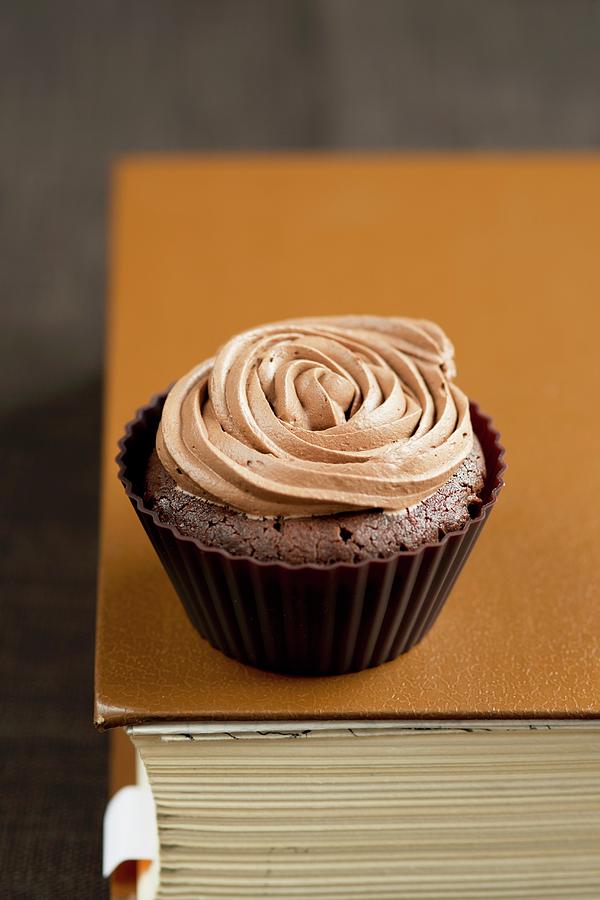 A Chocolate Cupcake With A Rose Made Of Icing Photograph by Rejmer, Ewa