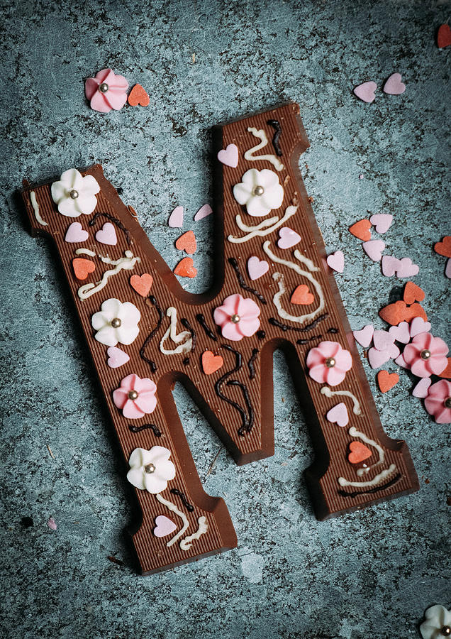 A Chocolate Letter M Decorated With Sugar Flowers And Hearts Photograph by Lucie Beck