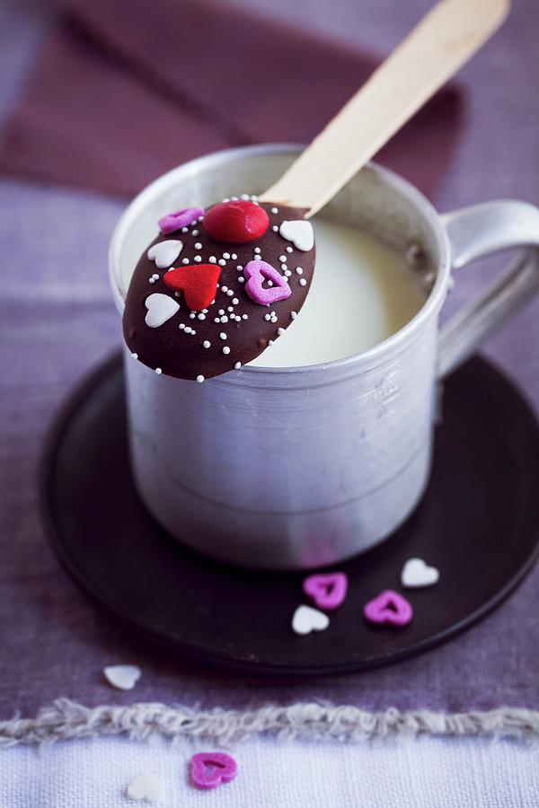A Chocolate Spoon Balanced On A Cup Of Milk valentines Day Photograph by Eising Studio