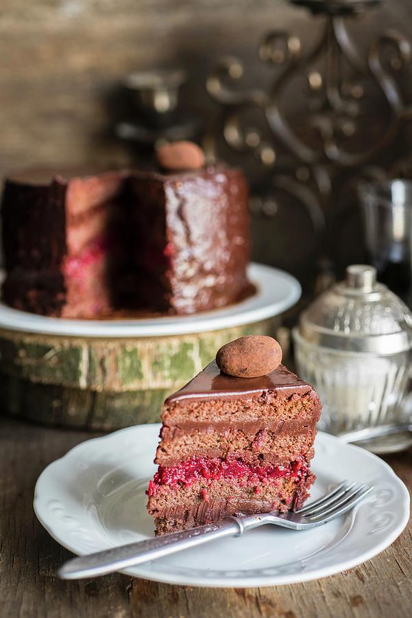 A Chocolate Truffle Cake With Cherry Jam Filling Photograph by Irina Meliukh