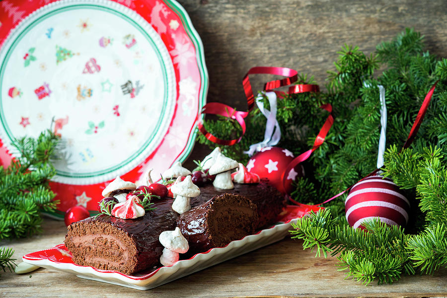 A Chocolate Yule Log Topped With Meringue Mushrooms For Christmas Photograph by Irina Meliukh