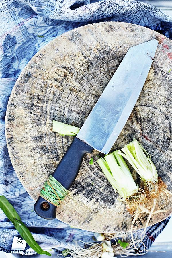 A Chopping Board And A Kitchen Knife Photograph by Ulf Svane