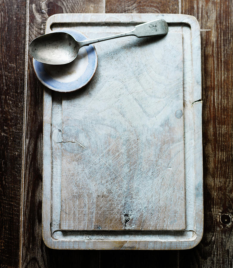 A Chopping Board With A Spoon And A Small Plate Photograph by Karen Thomas