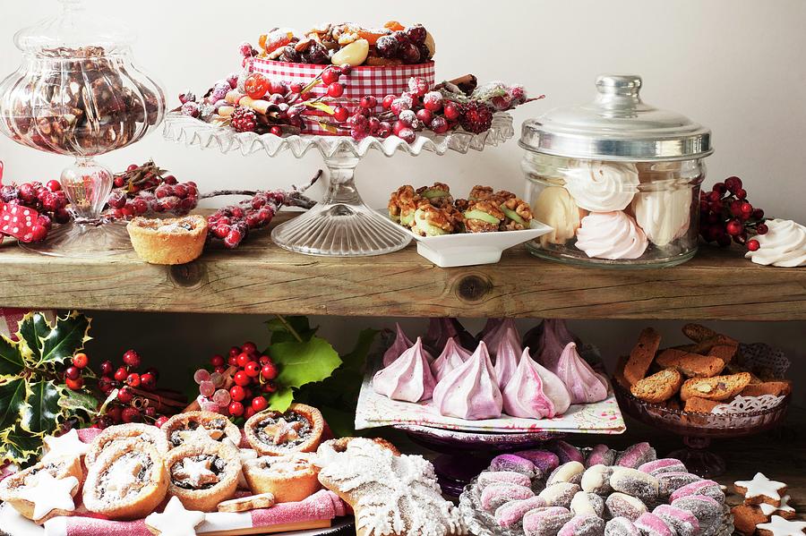 A Christmas Buffet Featuring Meringues, Stuffed Dates, Mince Pies, Christmas Cake And Biscuits Photograph by Linda Burgess