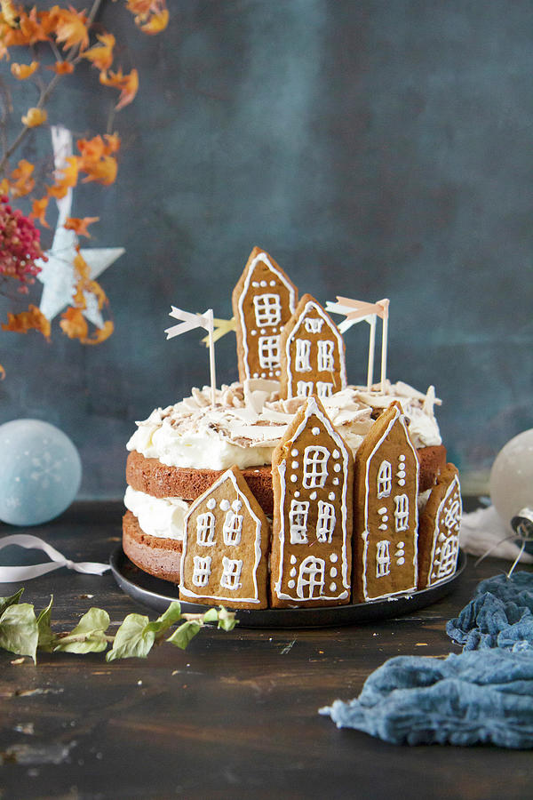 A Christmas Cake Decorated With Gingerbread Houses Photograph by Patricia Miceli