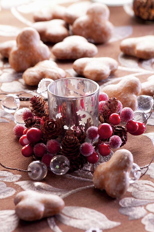 A Christmas Decoration With A Candle And Gingerbread Photograph by Wawrzyniak.asia