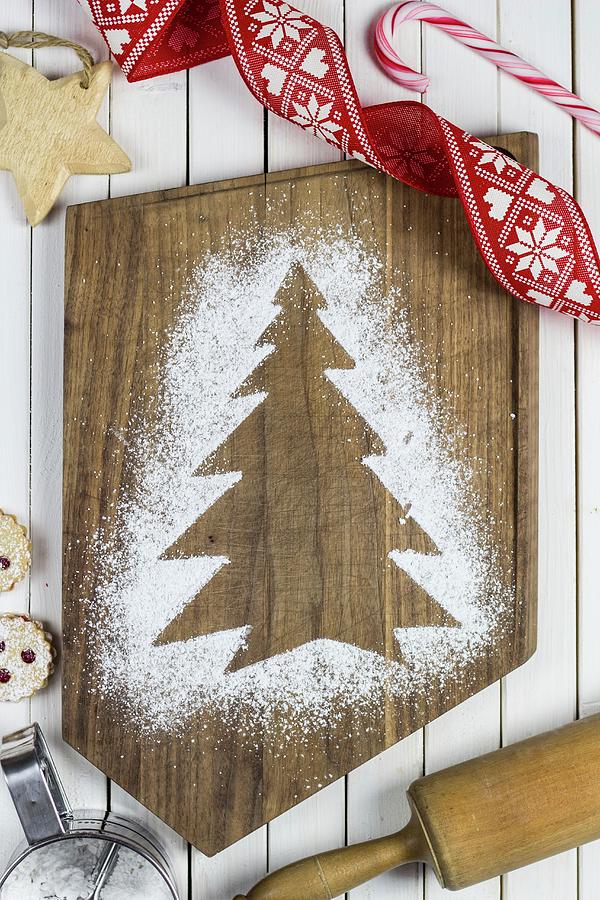 A Christmas Tree Print In Icing Sugar On A Chopping Board Photograph by The Stepford Husband