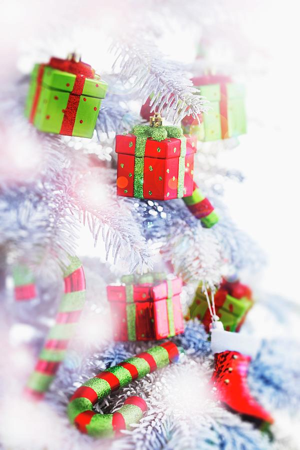 A Christmas Tree With Small Parcels As Decorations, And With Candy Canes Photograph by Axel Weiss