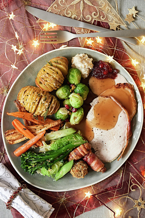 A Christmas Turkey With Bacon, Vegetables And Hasselback Potatoes Photograph by Jonathan Short