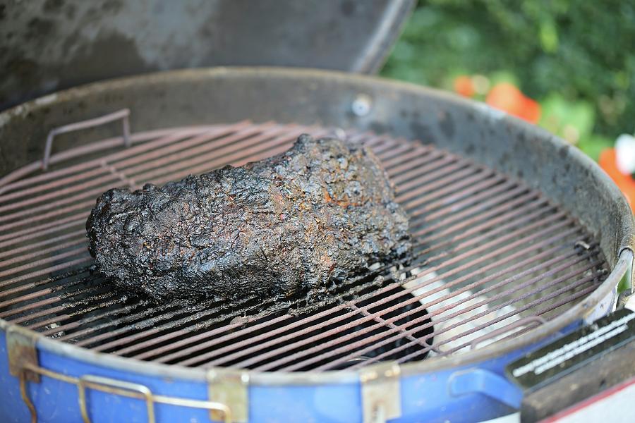 A Chunk Of Barbecue Pulled Pork With A Black Crust On The Barbecue Photograph by Sandra Krimshandl-tauscher