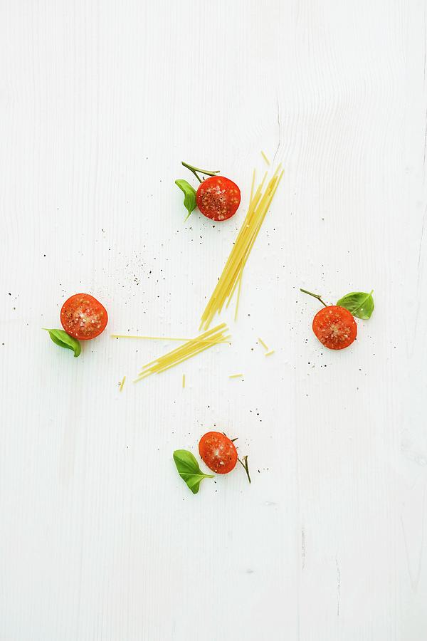 A Clock Face Made From Tomatoes, Basil And Spaghetti Photograph by Michael Wissing