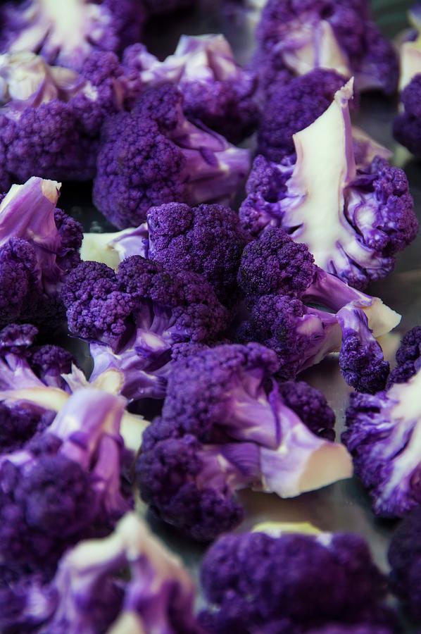 A Close Up View Of Chopped Purple Cauliflower Florets On Roasting Pan Photograph by Jennifer Blume