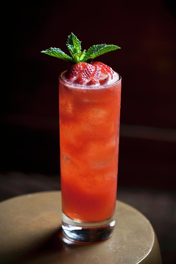 A Cocktail Made With Strawberries, Mineral Water And Mint Photograph by Lori Eanes