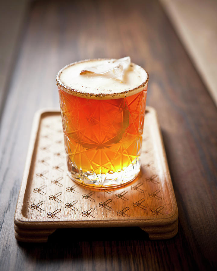A Cocktail On A Wooden Board At A Bar Photograph by Great Stock!