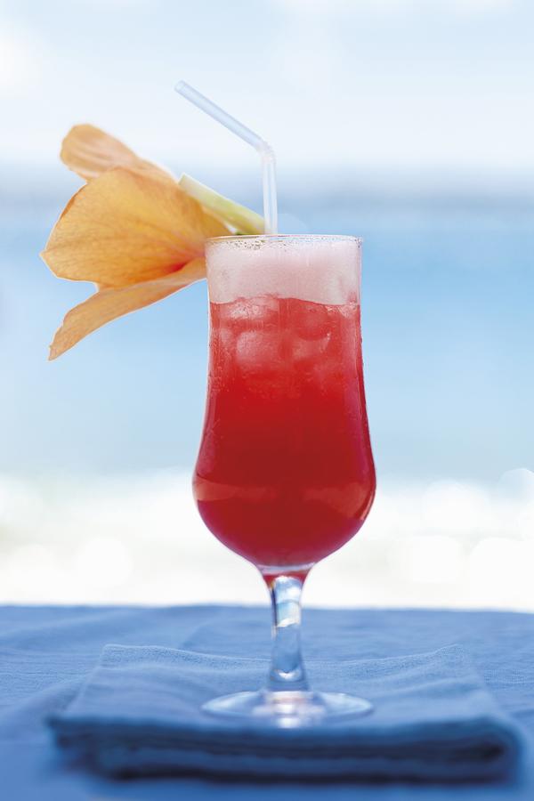 A Cocktail On The Beach, Decorated With A Flower Photograph by Great Stock!