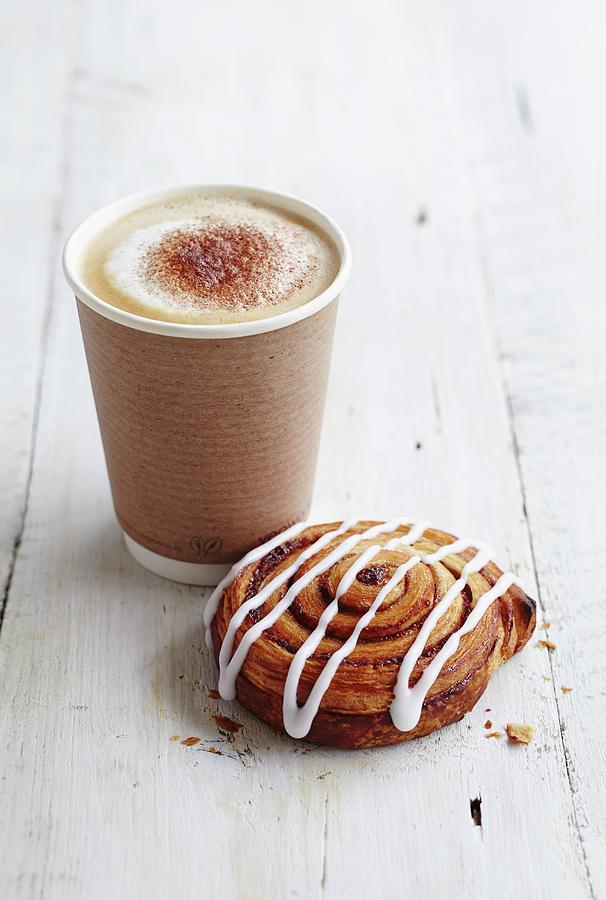 A Coffee Cup To Take Away With An Iced Danish Pastry Photograph by Charlotte Tolhurst