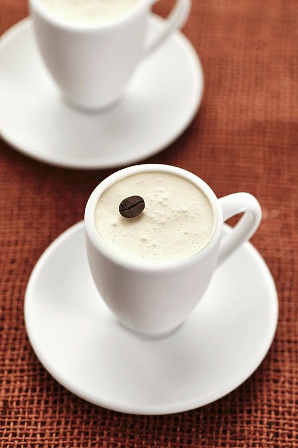 A Coffee Dessert Garnished With A Coffee Bean In A Mocha Cup Photograph by Herbert Lehmann