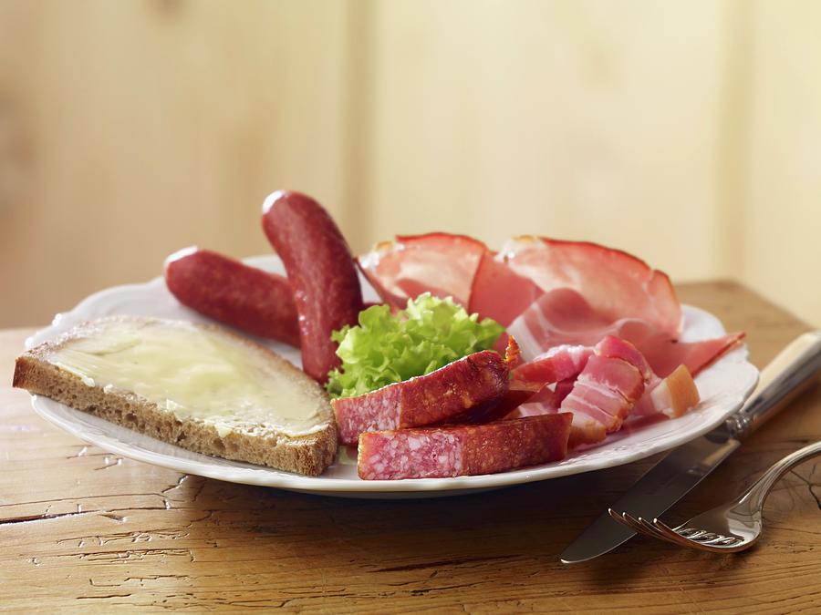 A Cold Meat Platter With A Slice Of Buttered Bread Photograph by Studio R. Schmitz