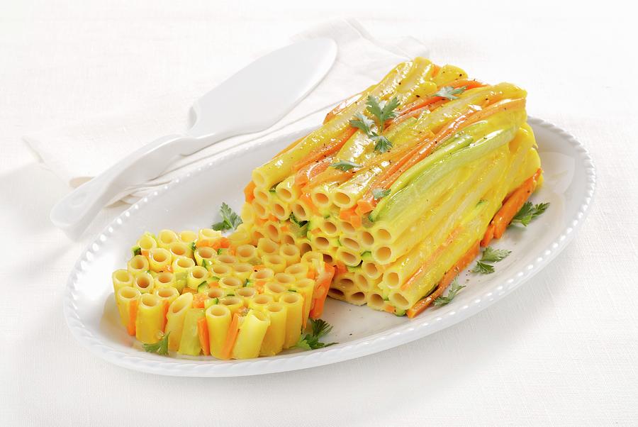A Colourful Ziti Pasta Terrine With Carrots And Celery Photograph by Franco Pizzochero