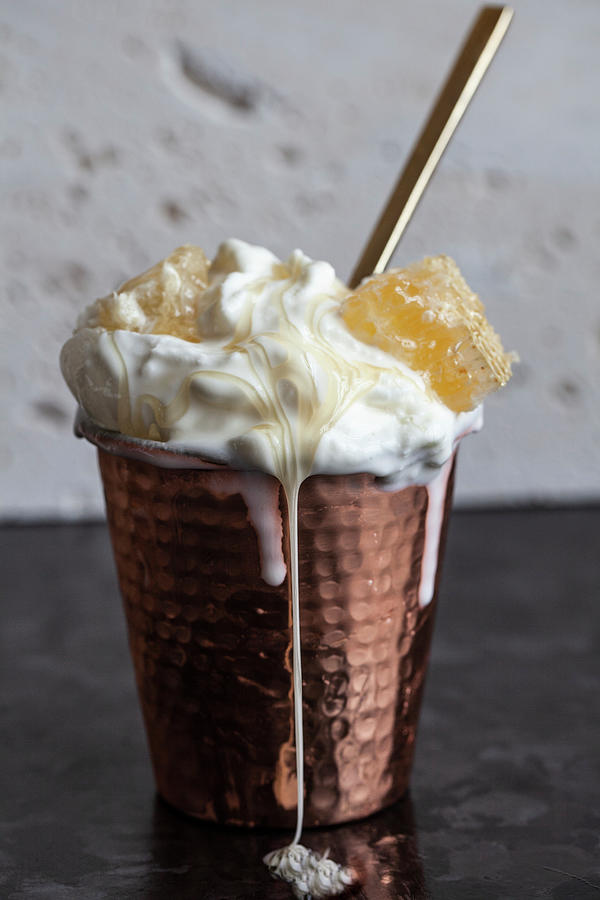 A Copper Cup Filled With Vanilla Ice Cream, Topped With Honey Comb And Drizzled With Honey Photograph by Ryla Campbell