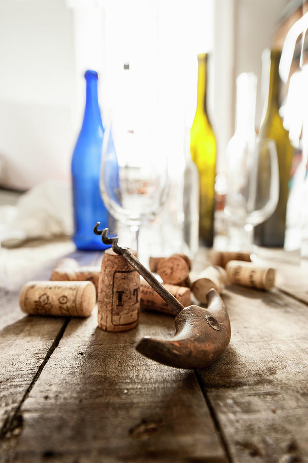 A Corkscrew, Corks, Empty Wine Bottles And Glasses Photograph by Piga & Catalano S.n.c.