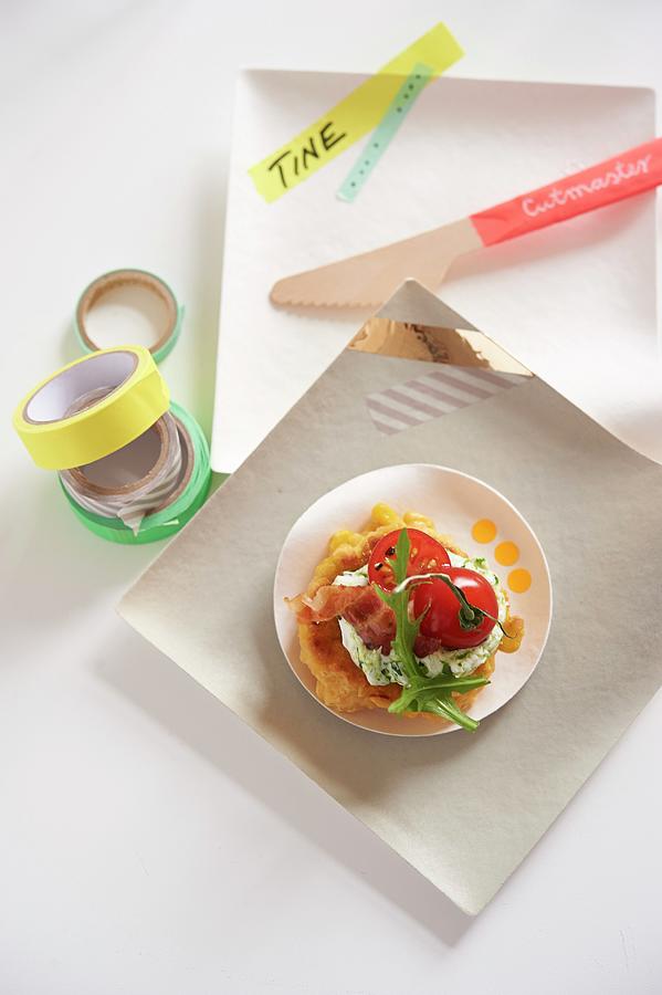 A Corn Cake With Cherry Tomatoes, Rocket Quark And Party Decorations Photograph by Jan-peter Westermann