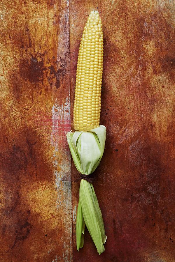 A Corn Cob With Leaves Photograph by Miriam Rapado