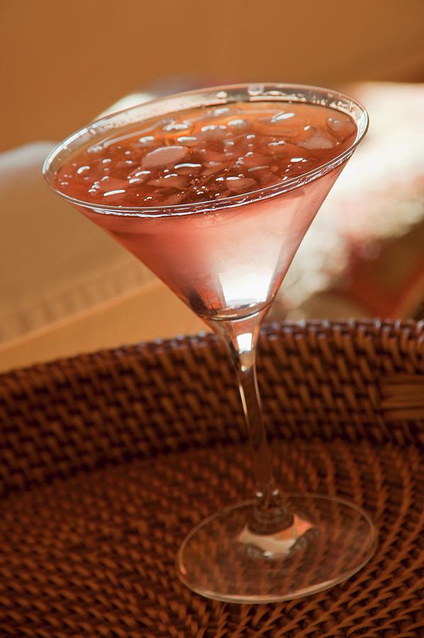 A Cosmopolitan Cocktail On A Cork Tray Photograph by William Boch