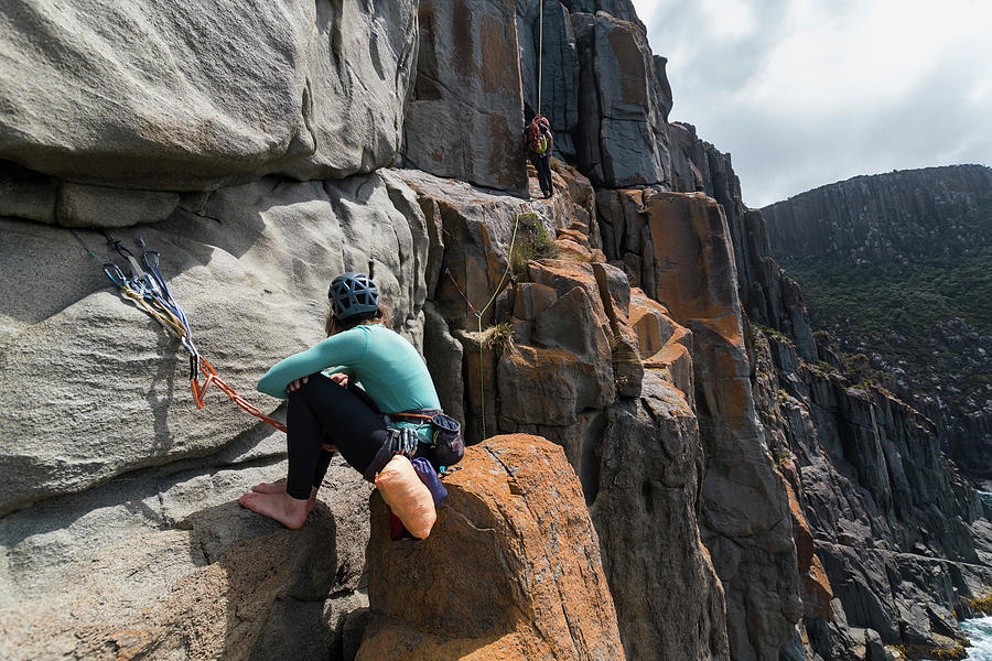 A Couple Of Explorers Uses Their Ropes To Rappel And Rockclimb While On An Adventure On The 5152