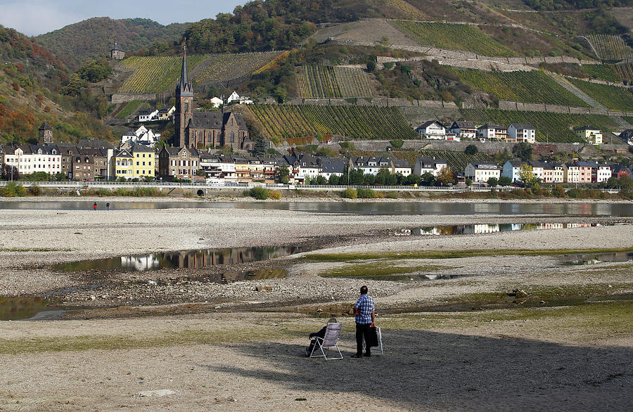 A Couple Rests Amid the River Bed Photograph by Wolfgang Rattay Fine