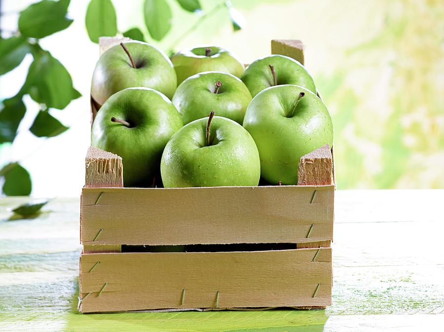 A Crate Of Granny Smith Apples Photograph by Ludger Rose
