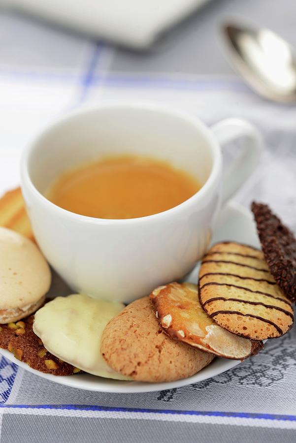 A Cup Of Espresso With Assorted Biscuits Photograph by Caste, Alain
