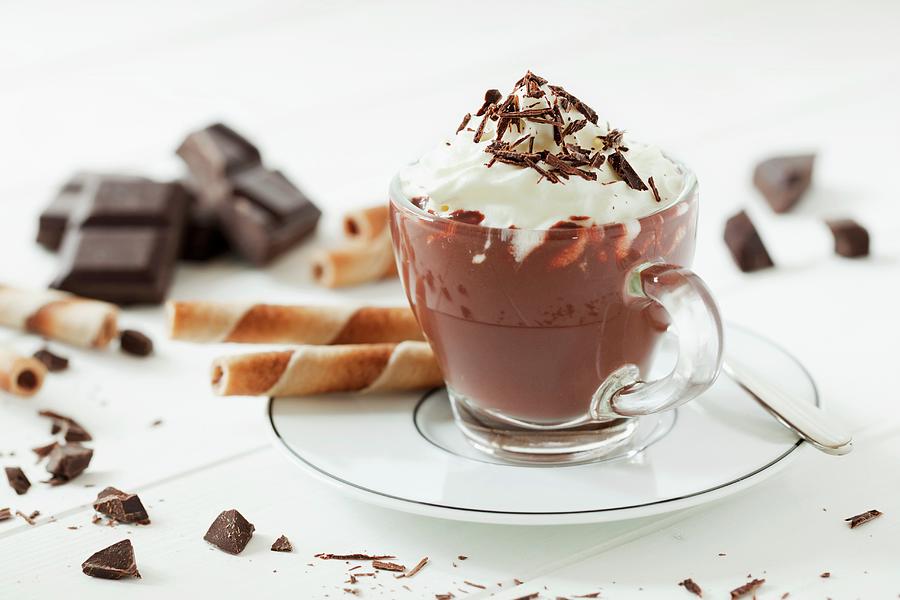 A Cup Of Hot Chocolate Topped With Cream And Grated Chocolate Along With Broken Chocolate And Wafer Curls Photograph by Jane Saunders