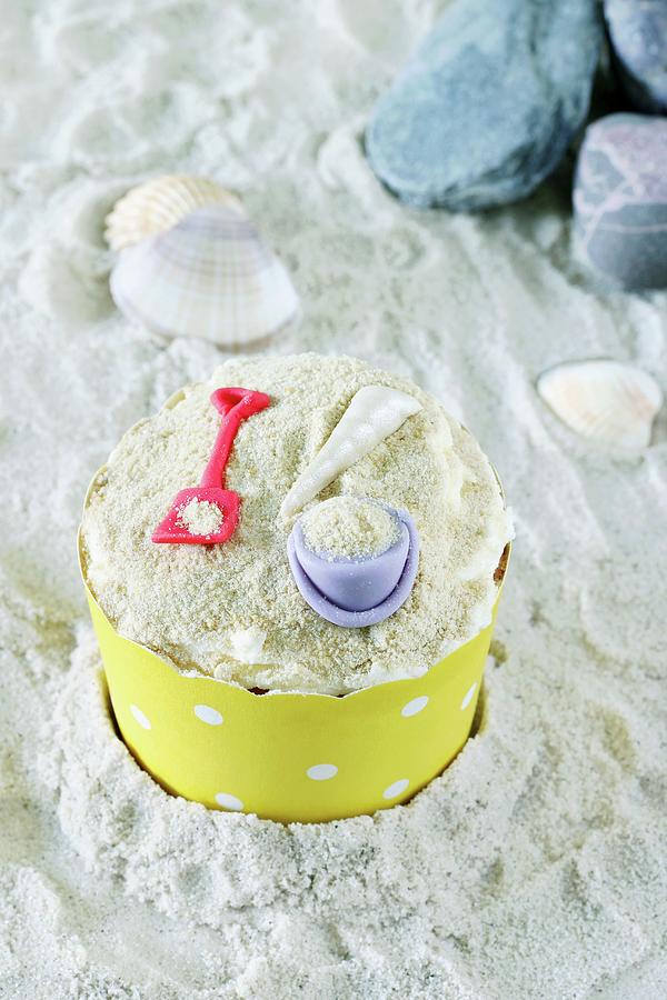 A Cupcake Decorated With A Bucket And Spade Photograph by Philip Mowbray And Hercules Cakehouse